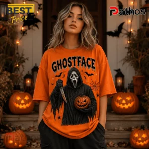 Ghostface Orange Halloween 2026 T-Shirt featuring a black graphic of a masked slasher holding a pumpkin and knife.