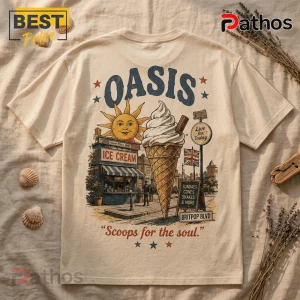 Oasis Ice Cream Day Cream T-Shirt 2026 1 Cream-colored t-shirt featuring a retro Oasis Britpop illustration with an ice cream cone, sun, and vintage street scene.!