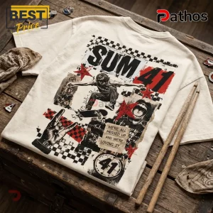 Sum 41 No Rules Full Volume Off-White T-Shirt 2 Cream graphic t-shirt featuring Sum 41 band artwork, a skateboarder, checkerboard patterns, and red stars on wood surface.!