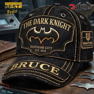 Batman The Dark Knight Gotham City personalized black cap with gold embroidery, Wayne Enterprises badge, and Bruce lettering.