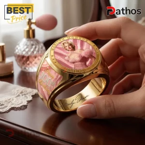 Marilyn Monroe 100th Anniversary Gold Engraved Ring featuring a portrait on pink enamel with gold-tone metal band details.