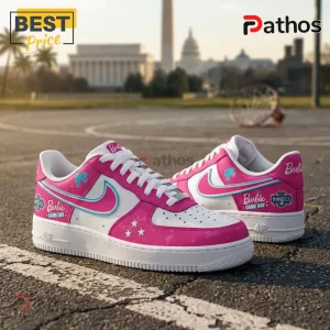 Barbie x Washington Mystics Pink Nike Air Force 1 Sneakers 3 Barbie x Washington Mystics Pink Nike Air Force 1 sneakers with white laces on a basketball court background.