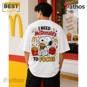Snoopy McDonald's Fries and Burger T-Shirt worn by a man featuring a cartoon graphic with text I NEED MCDONALD'S TO FOCUS.