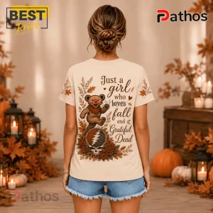 Grateful Dead Fall Dancing Bear T-Shirt in beige with autumnal leaf patterns, a dancing bear, and typography on the back.