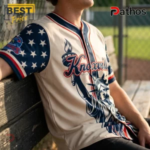 Knoxville Smokies 2026 USA Independence Day Baseball Jersey 3 Cream-colored button-down baseball jersey with blue sleeves featuring white stars, Statue of Liberty graphic, and Knoxville.!