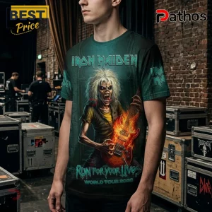 Iron Maiden Run For Your Lives 2026 Tour Apparel Hoodie 4 Man wearing an Iron Maiden graphic t-shirt featuring Eddie holding a flaming guitar with Run For Your Lives text.!
