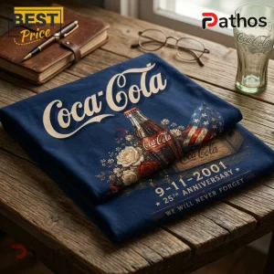 Coca Cola 9-11 25th Anniversary T-Shirt 1 Coca Cola 9-11 25th Anniversary T-Shirt in navy blue featuring a glass bottle, American flag, and floral graphics.