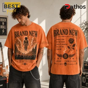 Brand New Astronaut Vintage Washed T-Shirt in orange featuring a space graphic on front and rose illustration on back.