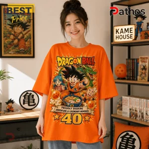 Dragon Ball 1986-2026 Anniversary Orange T-Shirt 3 Dragon Ball 1986-2026 Anniversary Orange T-Shirt worn by a smiling person featuring anime characters and text graphics.