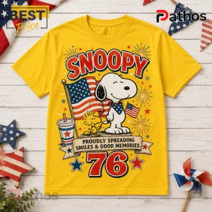 Snoopy 76th Anniversary Patriotic Yellow T-Shirt 1 Snoopy 76th Anniversary Patriotic Yellow T-Shirt featuring Snoopy, Woodstock, and American flag graphics on a bright base.