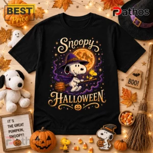 The Peanuts Gang Snoopy Halloween black T-shirt features a witch-hatted Snoopy and Woodstock flying on a broomstick.