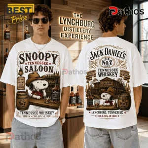 Snoopy Saloon Jack Daniel’s Tennessee Whiskey Shirt featuring a western-themed Snoopy graphic on a white cotton tee.