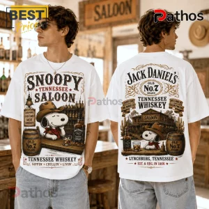 Snoopy Saloon Jack Daniel’s Tennessee Whiskey Shirt featuring Snoopy in a cowboy hat at a saloon on a white cotton t-shirt.
