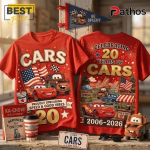 Disney Pixar Cars 20th Anniversary Red T-Shirt featuring Lightning McQueen, Mater, Radiator Springs, and patriotic graphics.