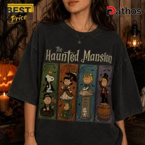 Peanuts Haunted House Halloween 2026 T-Shirt 3 Peanuts Haunted House Halloween 2026 T-Shirt featuring Snoopy and friends in gothic costumes on a black vintage wash tee.