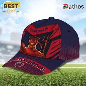 Melbourne Demons Navy Red Mascot Baseball Cap 1 Melbourne Demons Navy Red Mascot Baseball Cap featuring a red devil graphic, text branding, and a navy blue polyester base.