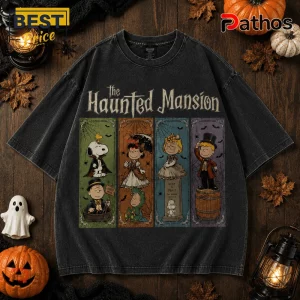 Peanuts Haunted House Halloween 2026 T-Shirt 1 Peanuts Haunted House Halloween 2026 T-Shirt featuring Snoopy and friends in costumes against a black washed fabric background.
