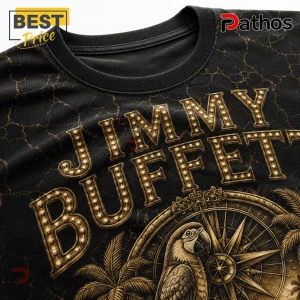 Jimmy Buffett Changes in Latitudes Vintage Tribute T-Shirt featuring gold marquee lettering, a compass, and parrot art.