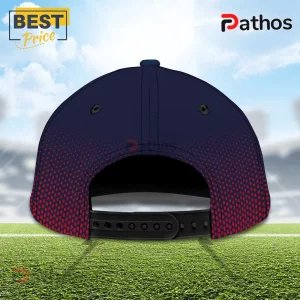 Melbourne Demons Navy Red Mascot Baseball Cap 3 Melbourne Demons Navy Red Mascot Baseball Cap featuring a dark blue crown, red dot gradient, and black adjustable snapback.