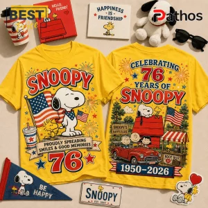 Snoopy 76th Anniversary Patriotic Yellow T-Shirt featuring Snoopy, Woodstock, US flags, fireworks, and vintage graphics.