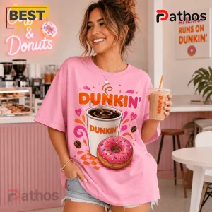 Dunkin Donuts Pink Coffee and Donuts T-Shirt 3 Dunkin Donuts Pink Coffee and Donuts T-Shirt featuring a graphic of a coffee cup, pink frosted donut, and orange text.